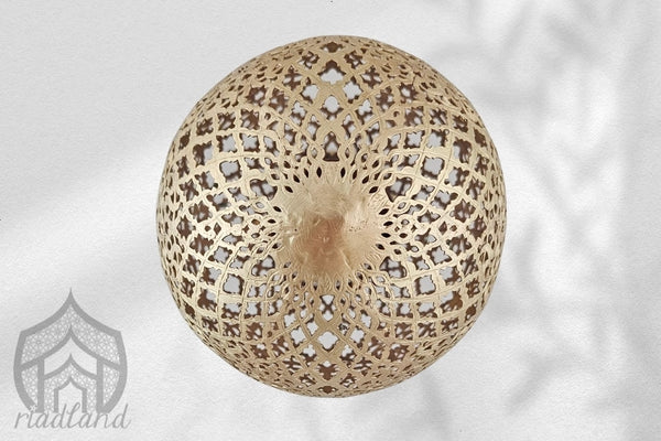 Bottom of a elegant golden brass lamp crafted from brass, boasting a tall and rounded profile