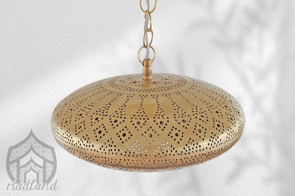 Handmade pendant light made of brass, showcasing artisanal craftsmanship