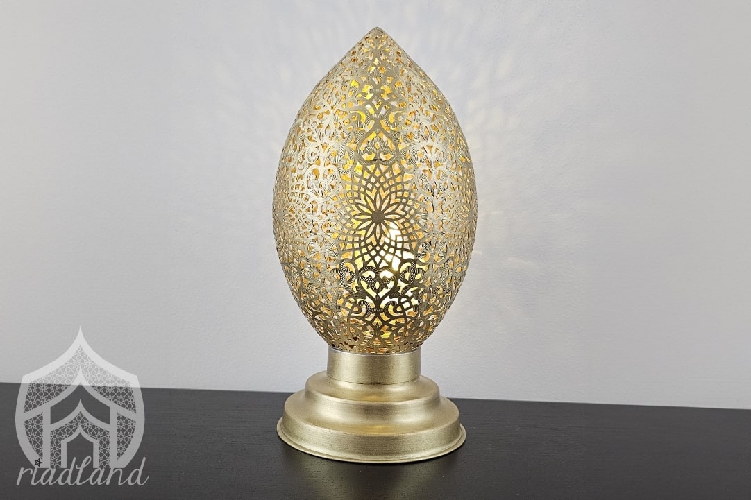 Shiny lamp in gold color which can perfectly serve as both a lamp and decoration in your home